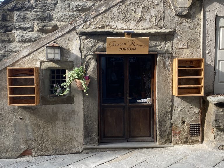 Best shops in Cortona — Tuscan Flowers boutique on a medieval street in Cortona, Tuscany